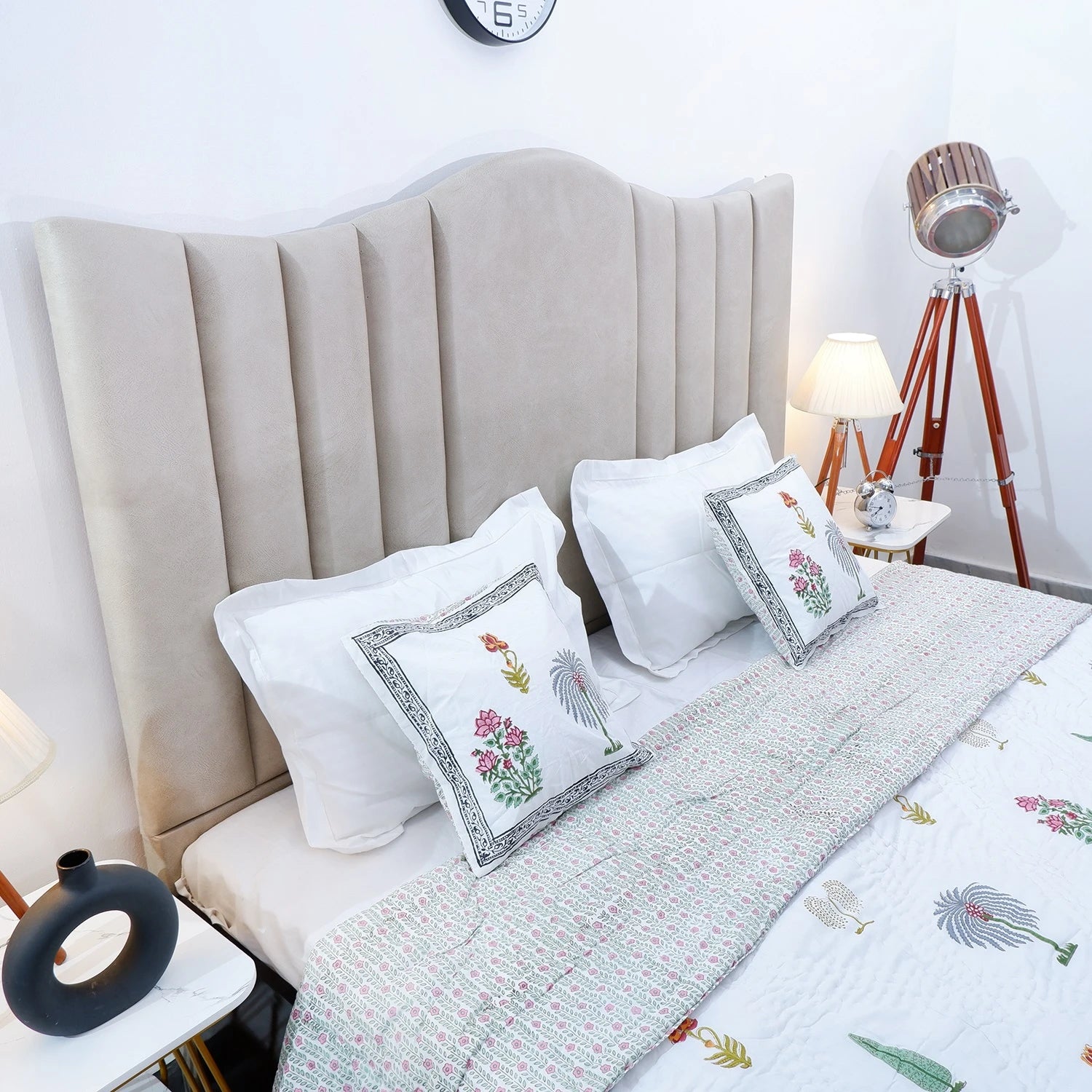 Elegant bedroom scene with a 100% cotton double bed quilt and decorative pillows on a stylish bed