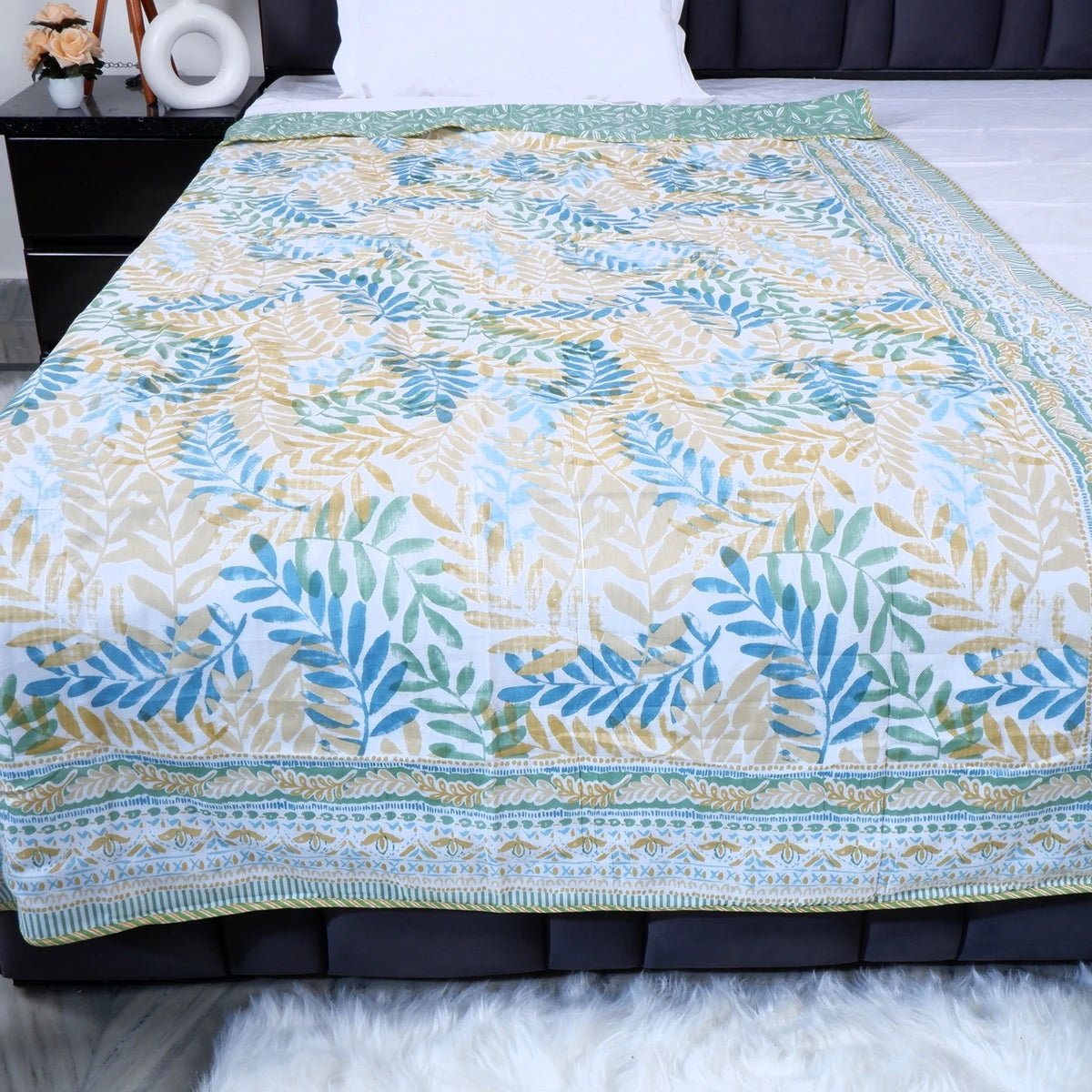 Dohar from The Jaipuri made of 100 percent mulmul cotton blanket with floral patterns in green and gold