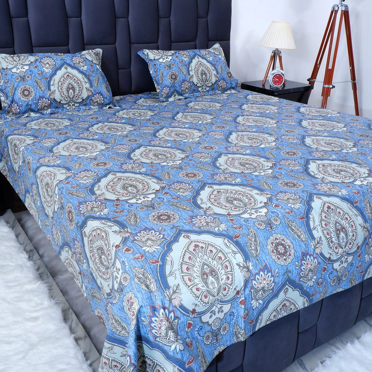 The Jaipuri 100 percent pure cotton bed sheet in blue with intricate floral patterns for comfortable sleeping.