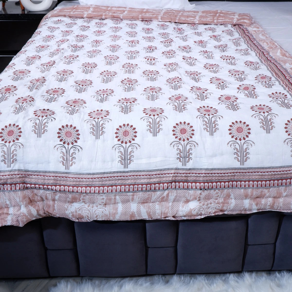 100% pure cotton quilt Jaipur featuring floral patterns in soft pink and white for cozy bedding