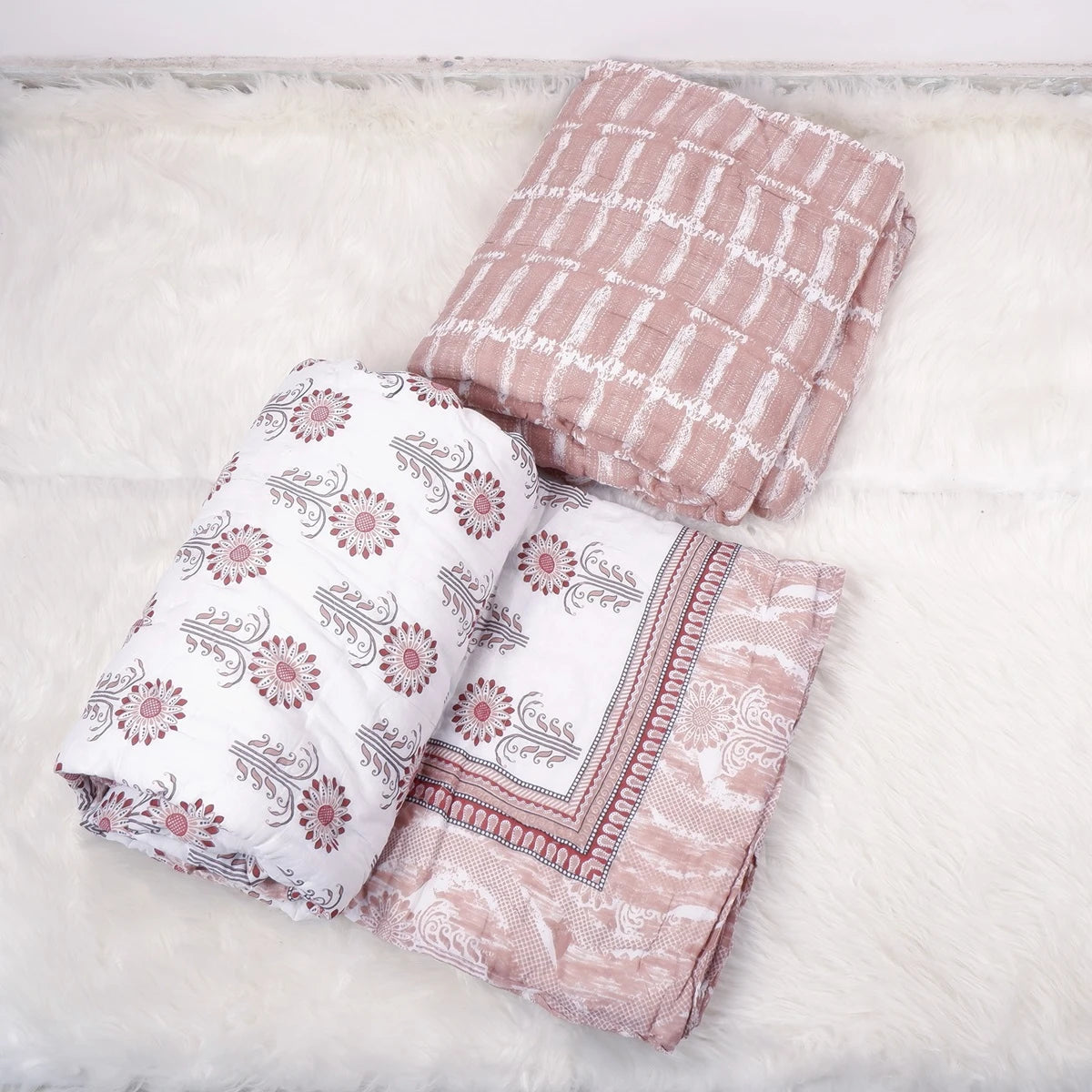 Three 100% pure cotton quilts Jaipur in various floral and geometric patterns, perfect for cozy bedding