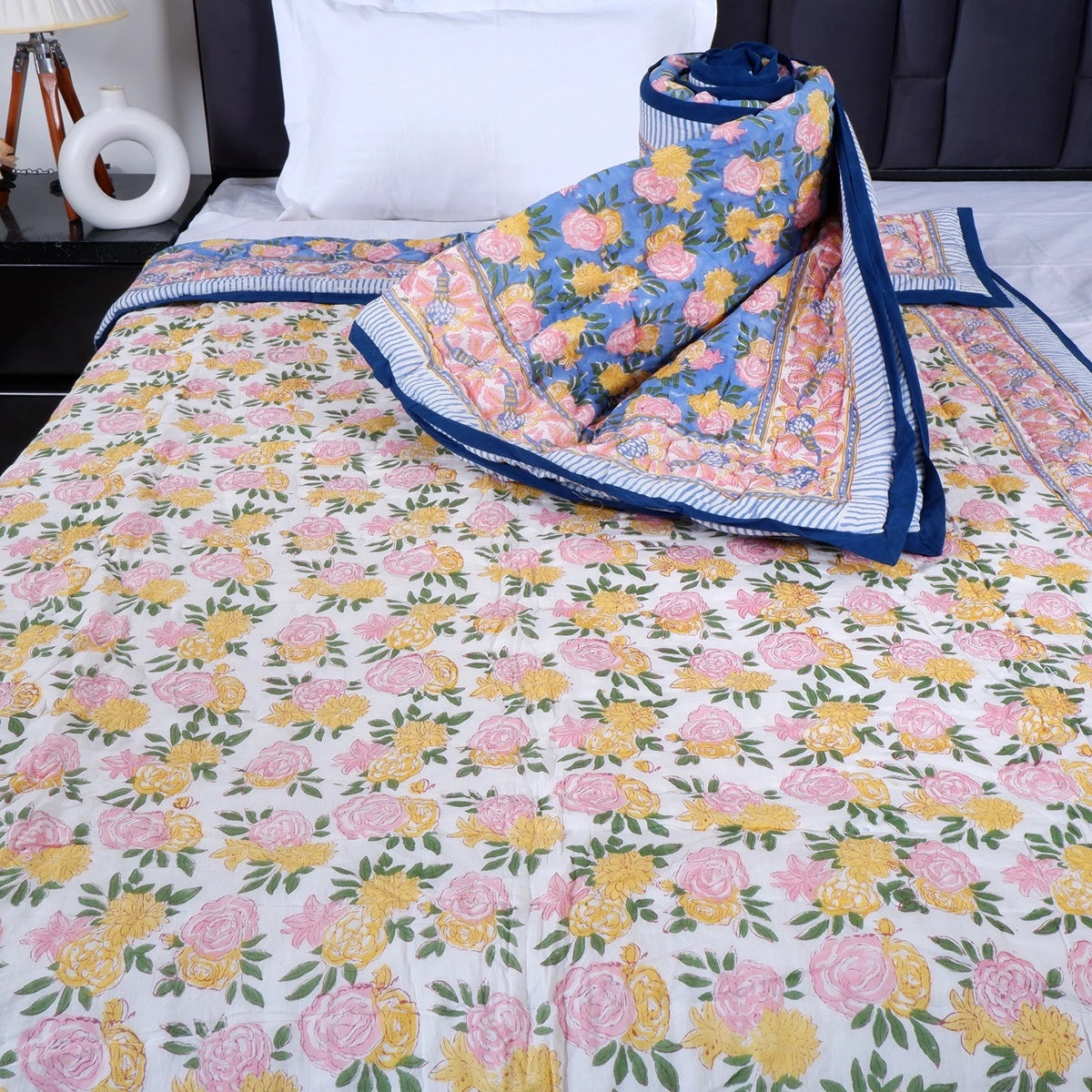 The Jaipuri 100% pure cotton single bed quilt with floral design in pink and blue colors