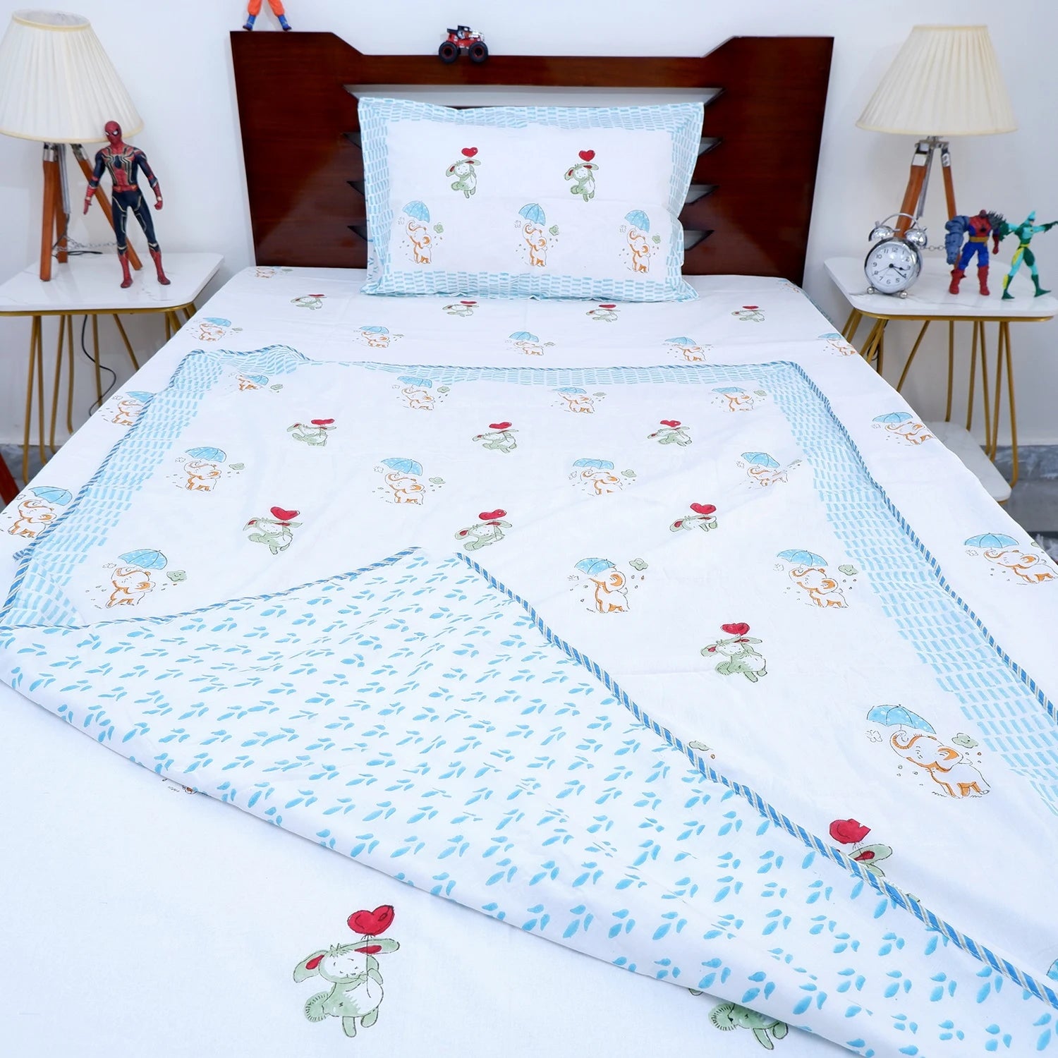 Hand block print kids dohar featuring playful animal designs in soft pastel colors