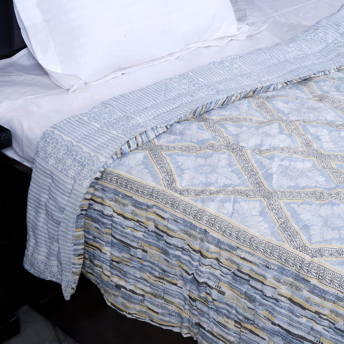 The Jaipuri 100% cotton single bed quilt in soft blue with intricate patterns for cozy bedding