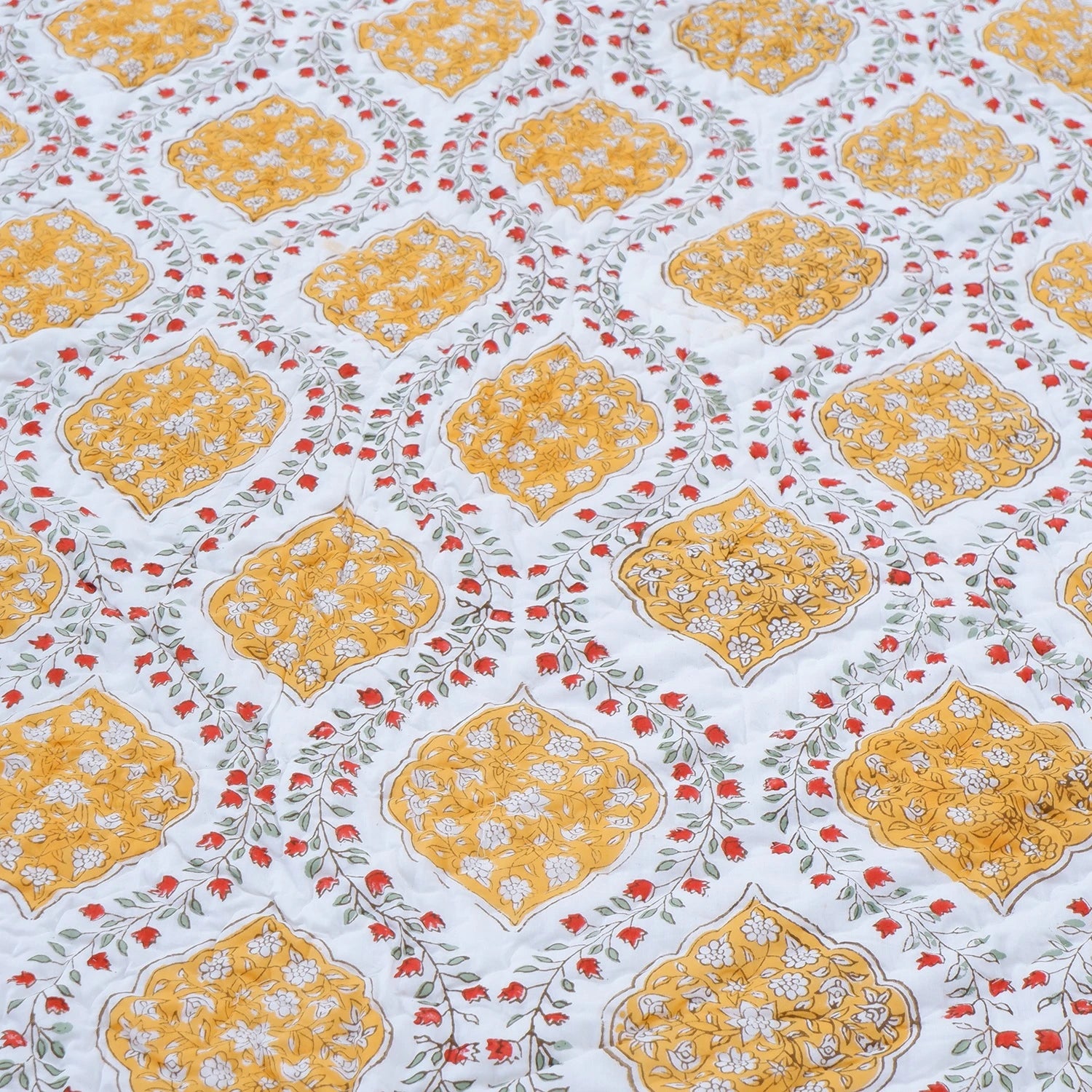 Beautiful block print cotton quilt for double bed featuring yellow and floral patterns