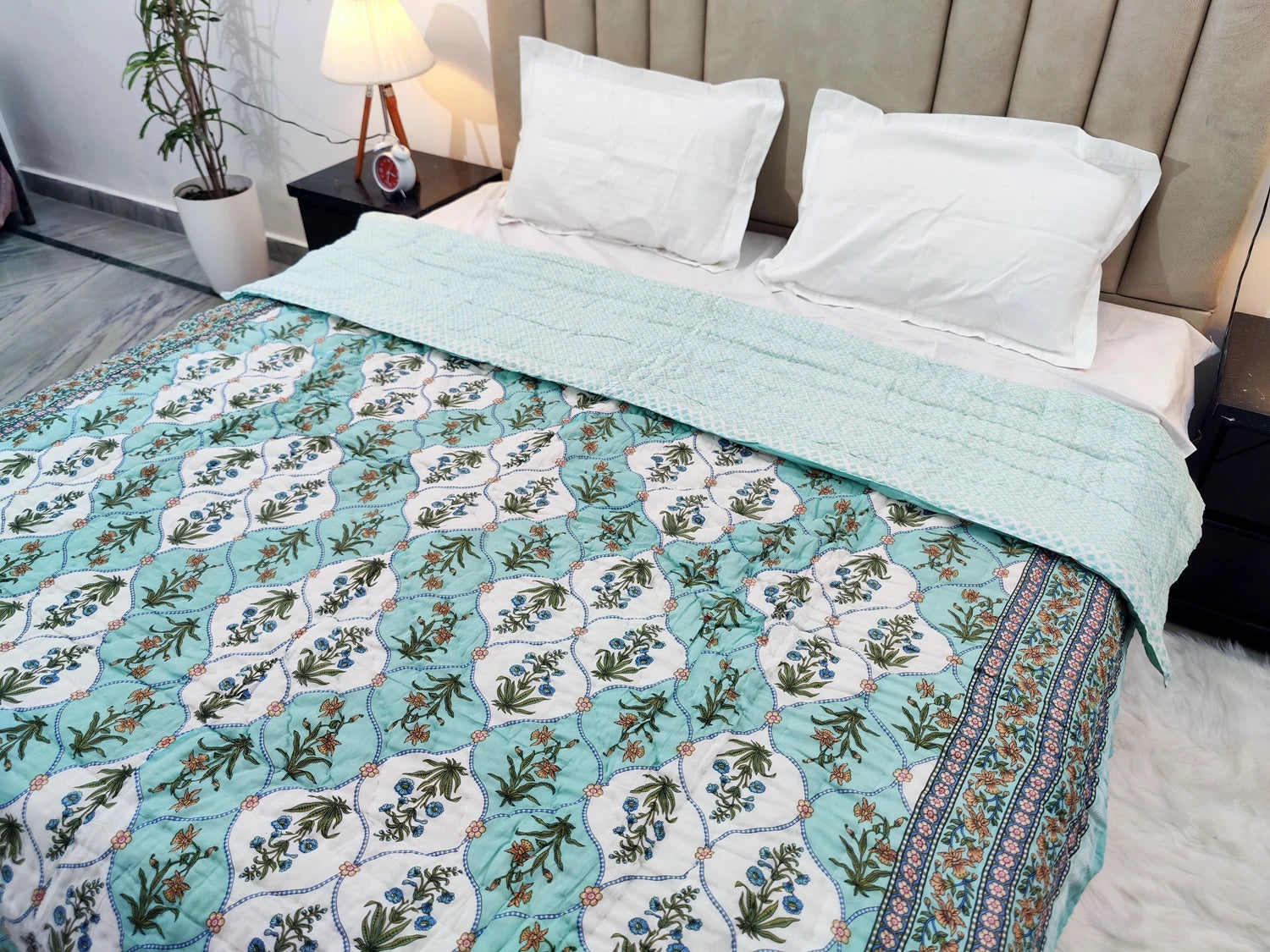 Elegant cotton quilt for double bed block print with floral designs in soothing colors