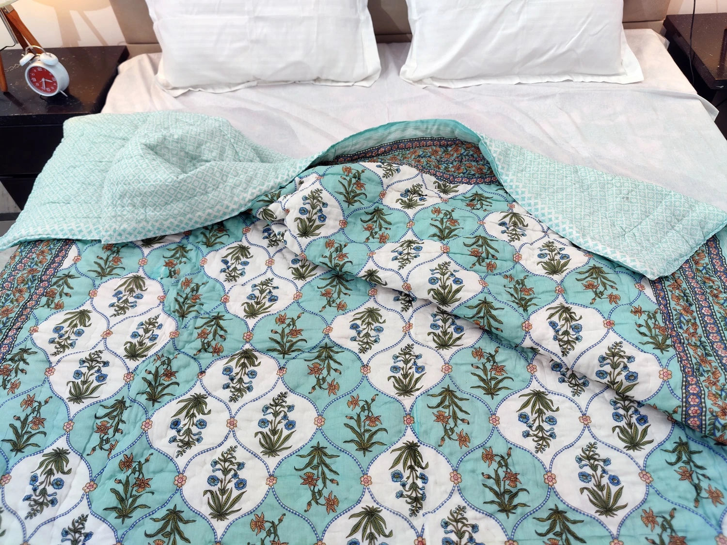 The Jaipuri cotton quilt for double bed block print with intricate floral patterns in soothing colors