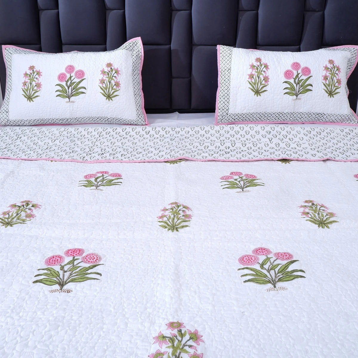 Hand block print cotton bedcover in white with floral design and matching pillow covers