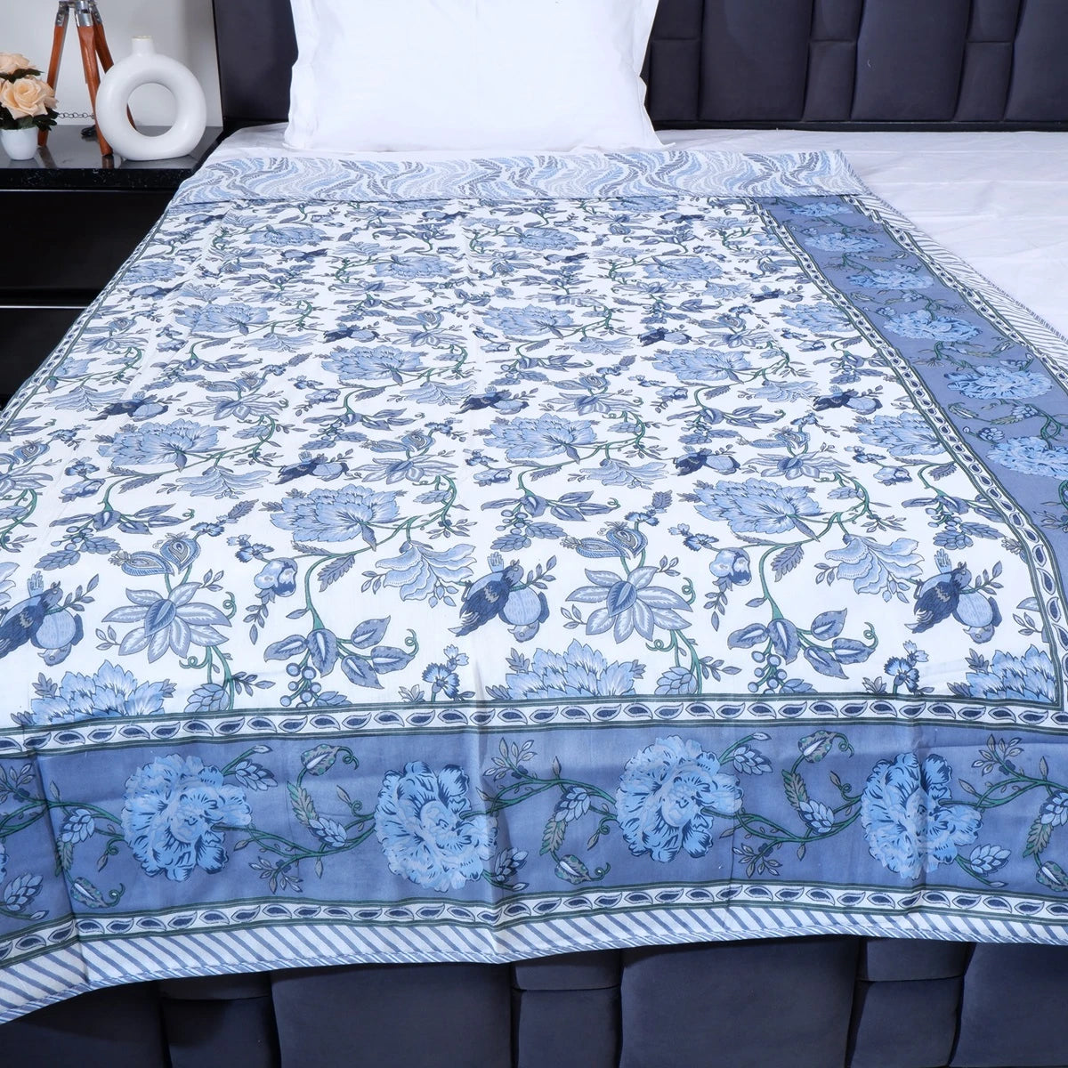 Hand block print mulmul cotton dohar with floral design in blue and white, perfect for warm nights