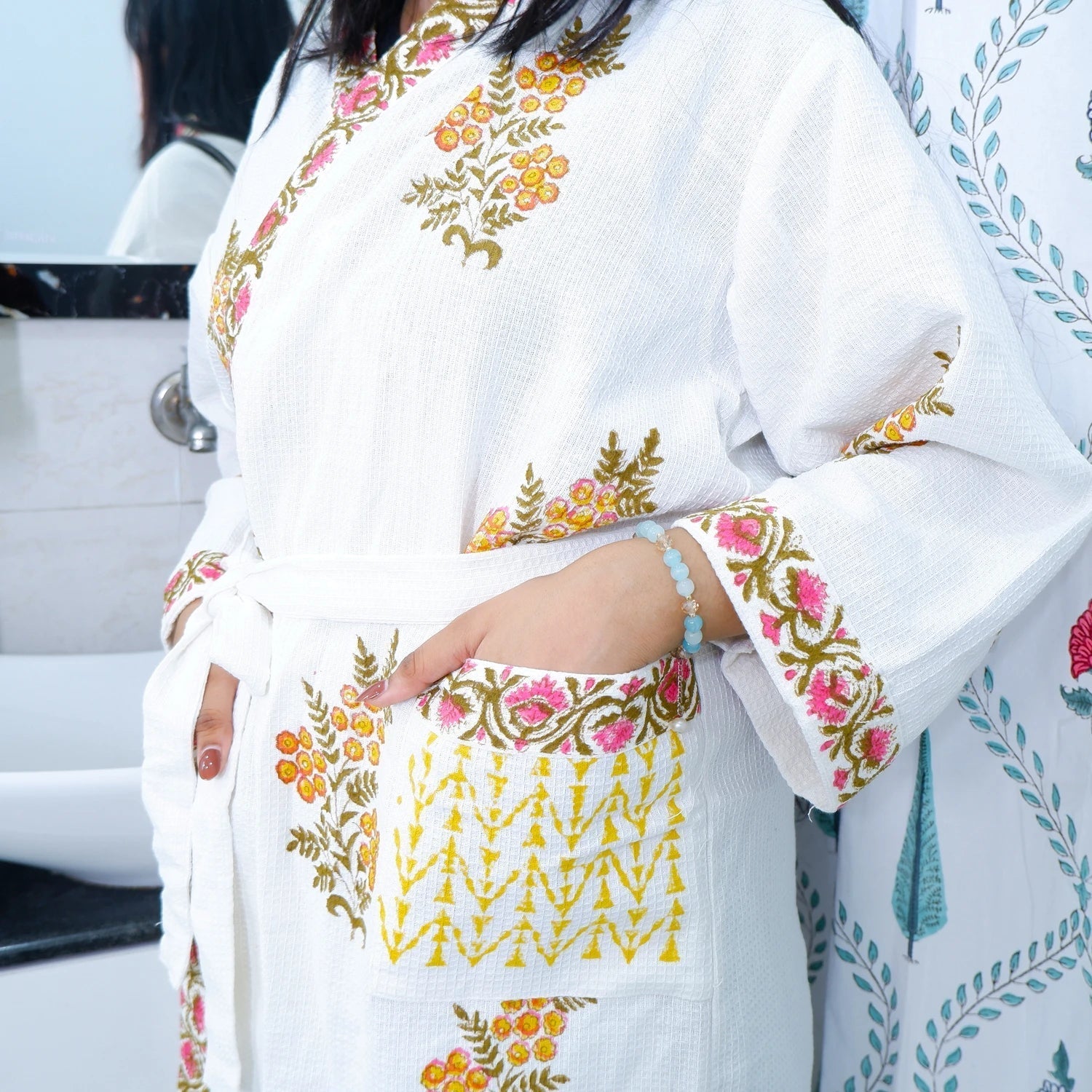Elegant hand block printed cotton bathrobe in white with colorful floral designs and pockets