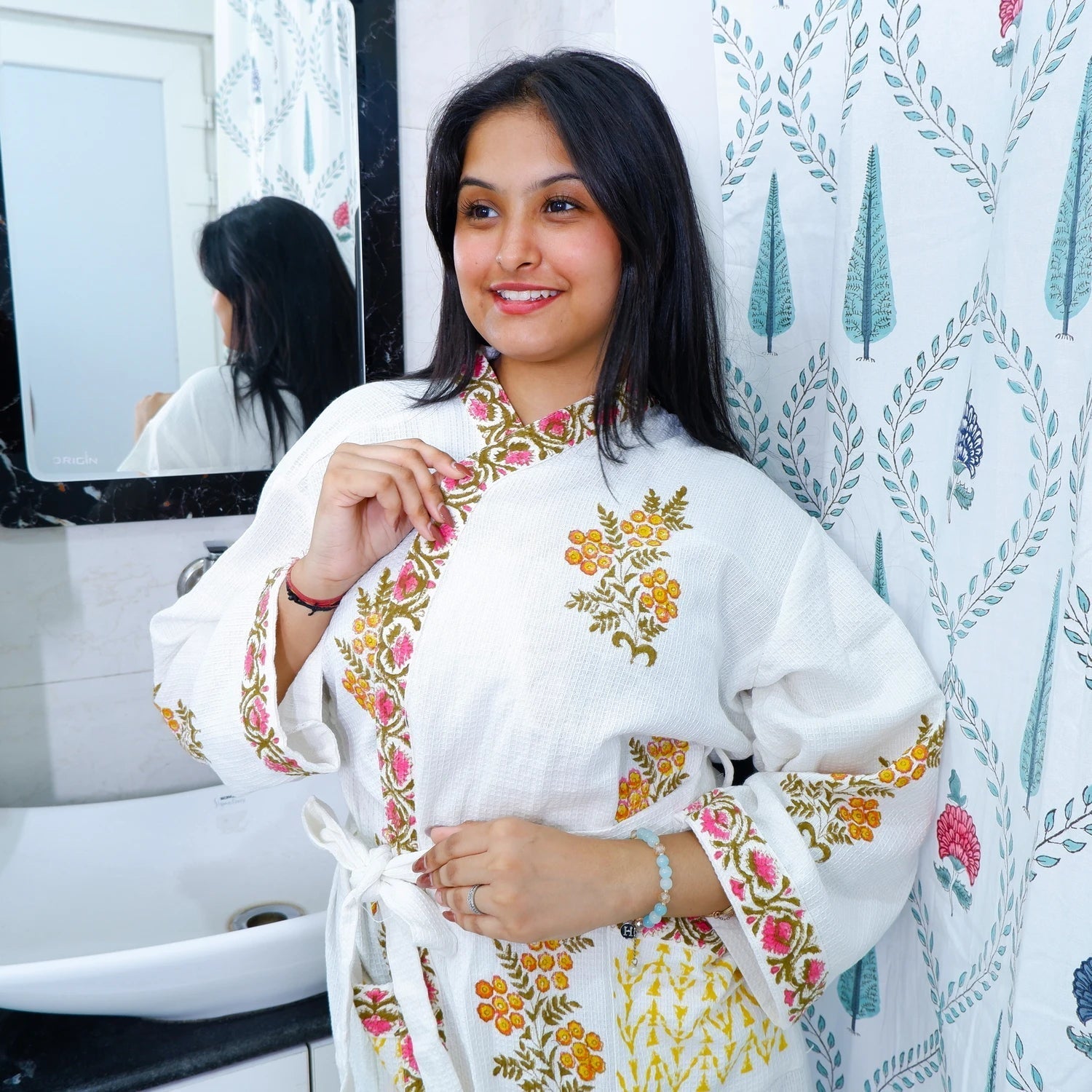 Hand block printed cotton bathrobe in white with floral designs, perfect for relaxing at home