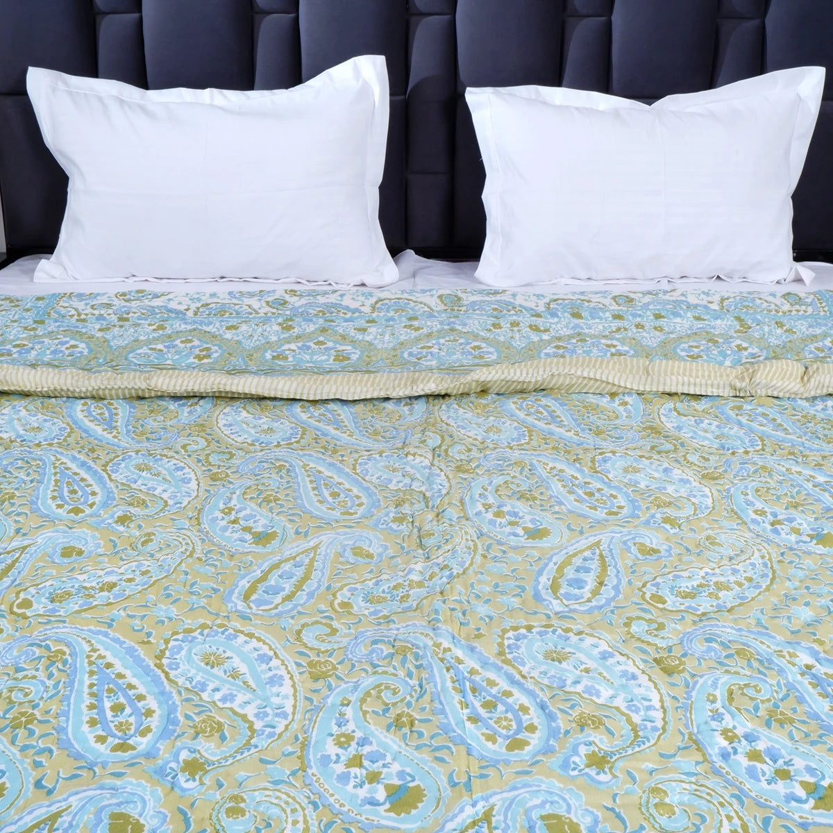 Jaipuri block print comforter for winter featuring a paisley design in blue and green colors