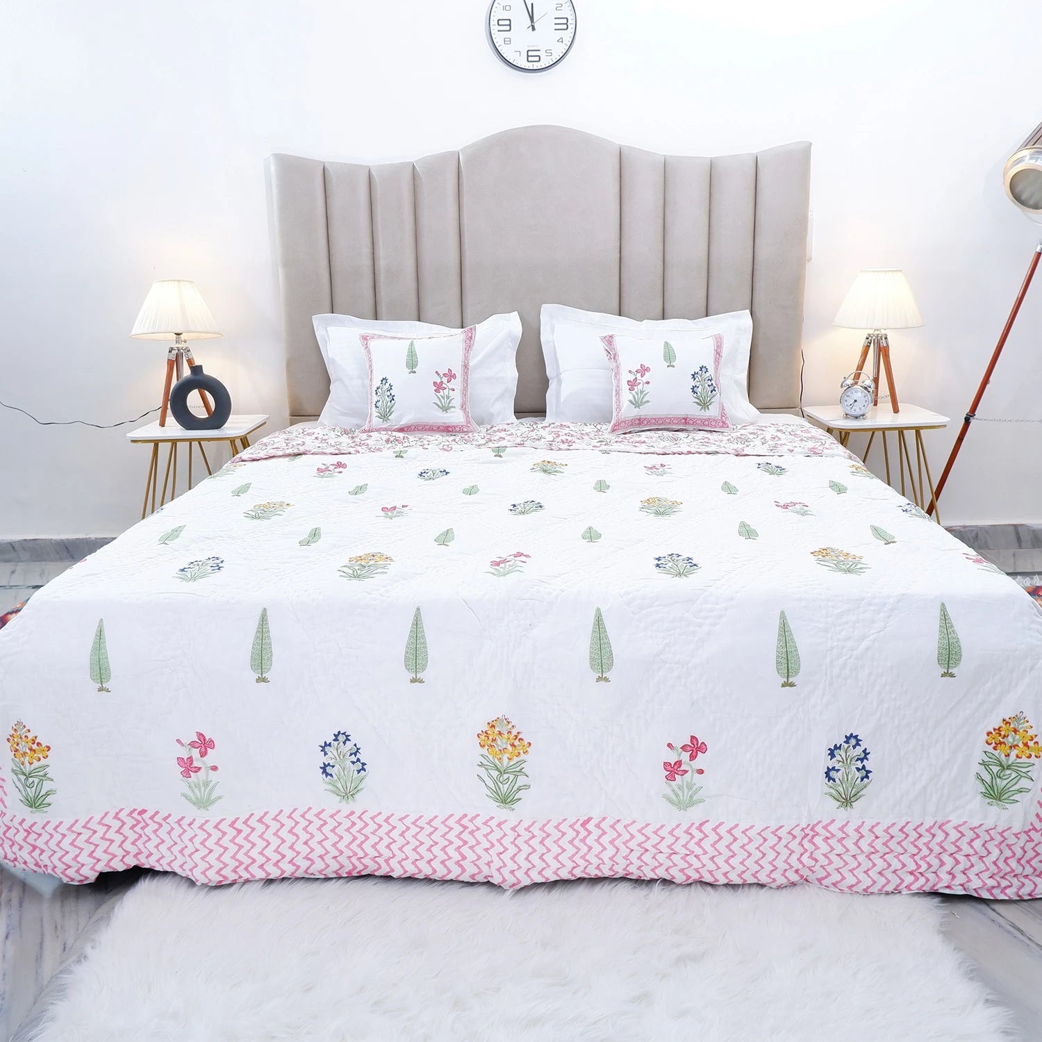 Jaipuri block print quilt set with floral patterns on a white background, perfect for bedroom decor
