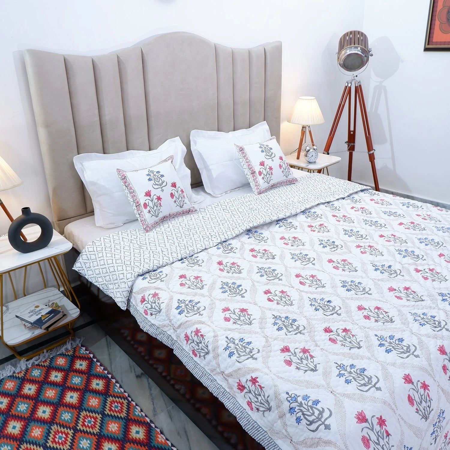 Jaipuri block print quilts featuring floral patterns on a stylish bed with elegant décor