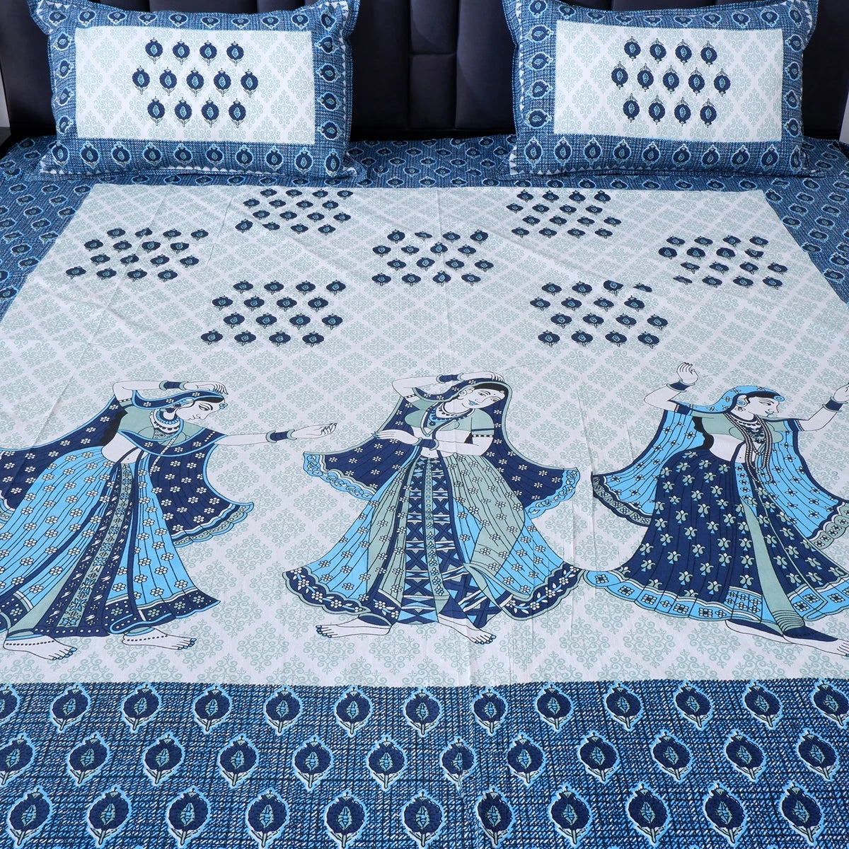 Jaipuri cotton bed sheet featuring traditional dance patterns in blue and white colors