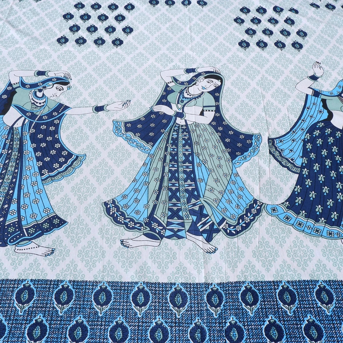 Jaipuri cotton bed sheet featuring traditional dancing motifs in blue and white patterns
