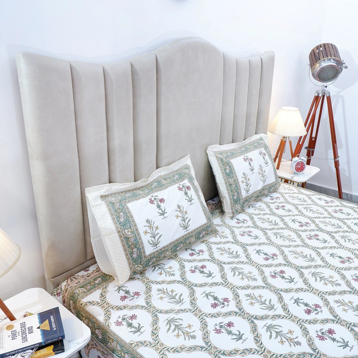 Jaipuri cotton bed sheet featuring intricate floral patterns on a stylish bed with matching pillows