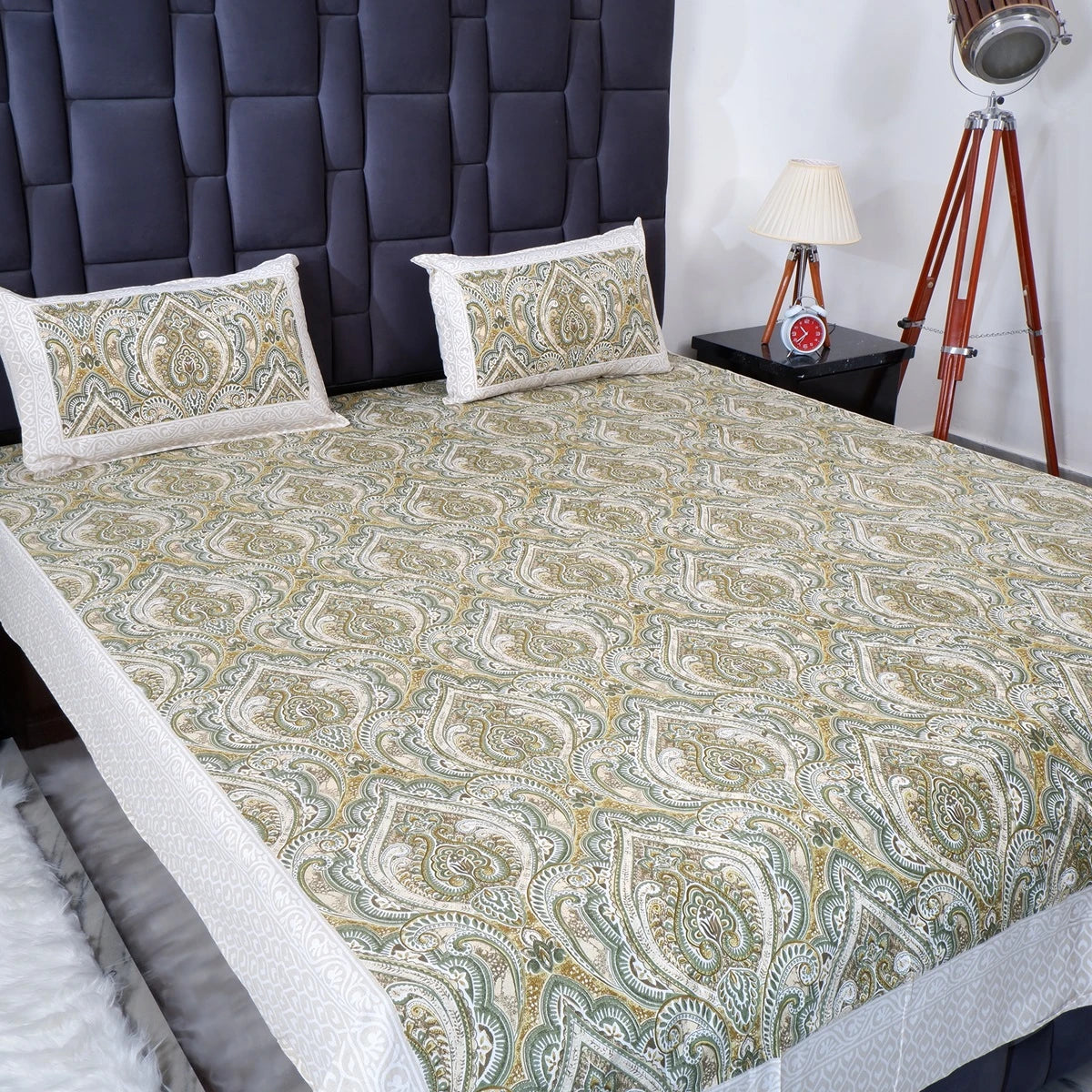 Jaipuri cotton bed sheet in paisley design with matching pillow covers on a stylish bed