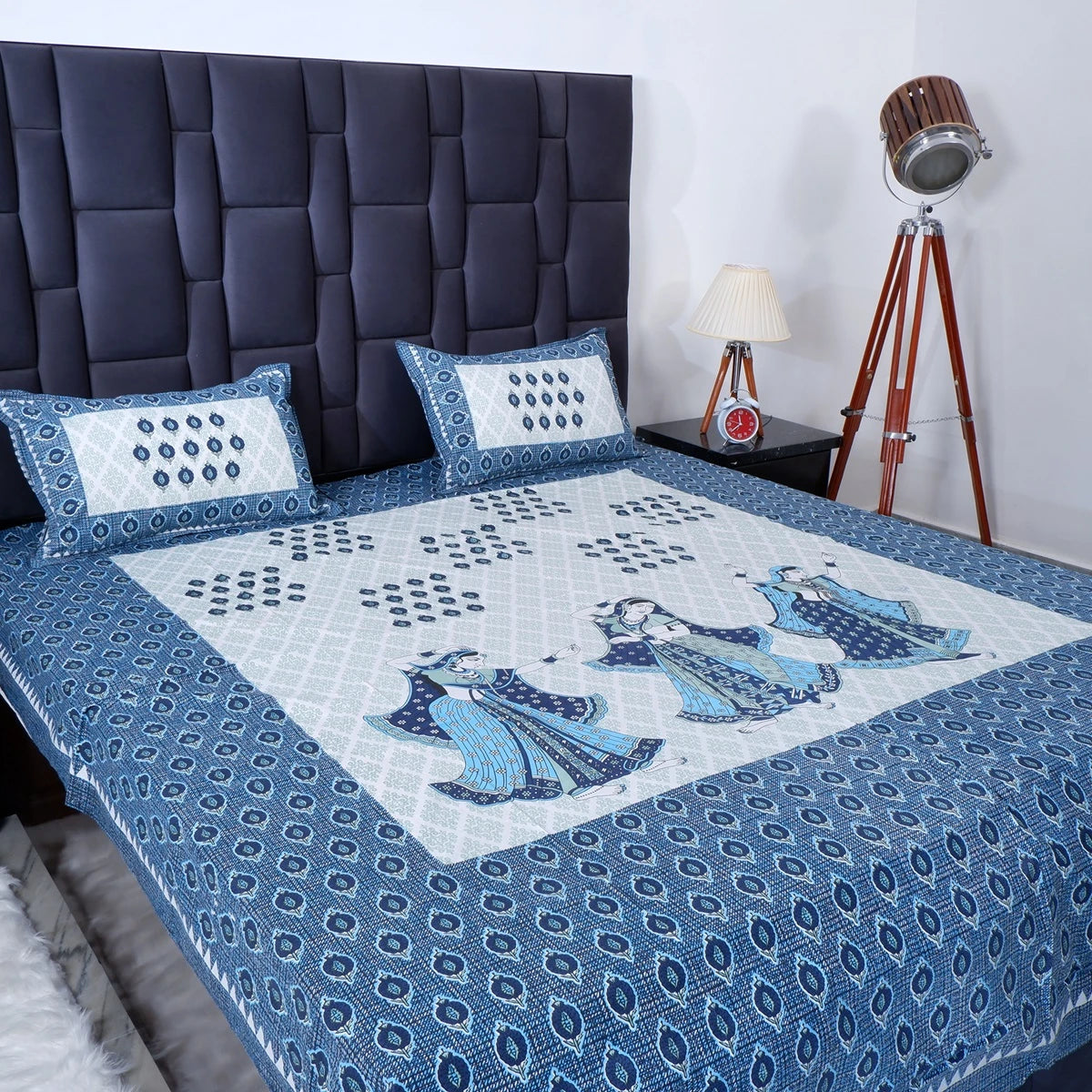 Jaipuri cotton bed sheet featuring intricate blue patterns and matching pillow covers in a stylish bedroom
