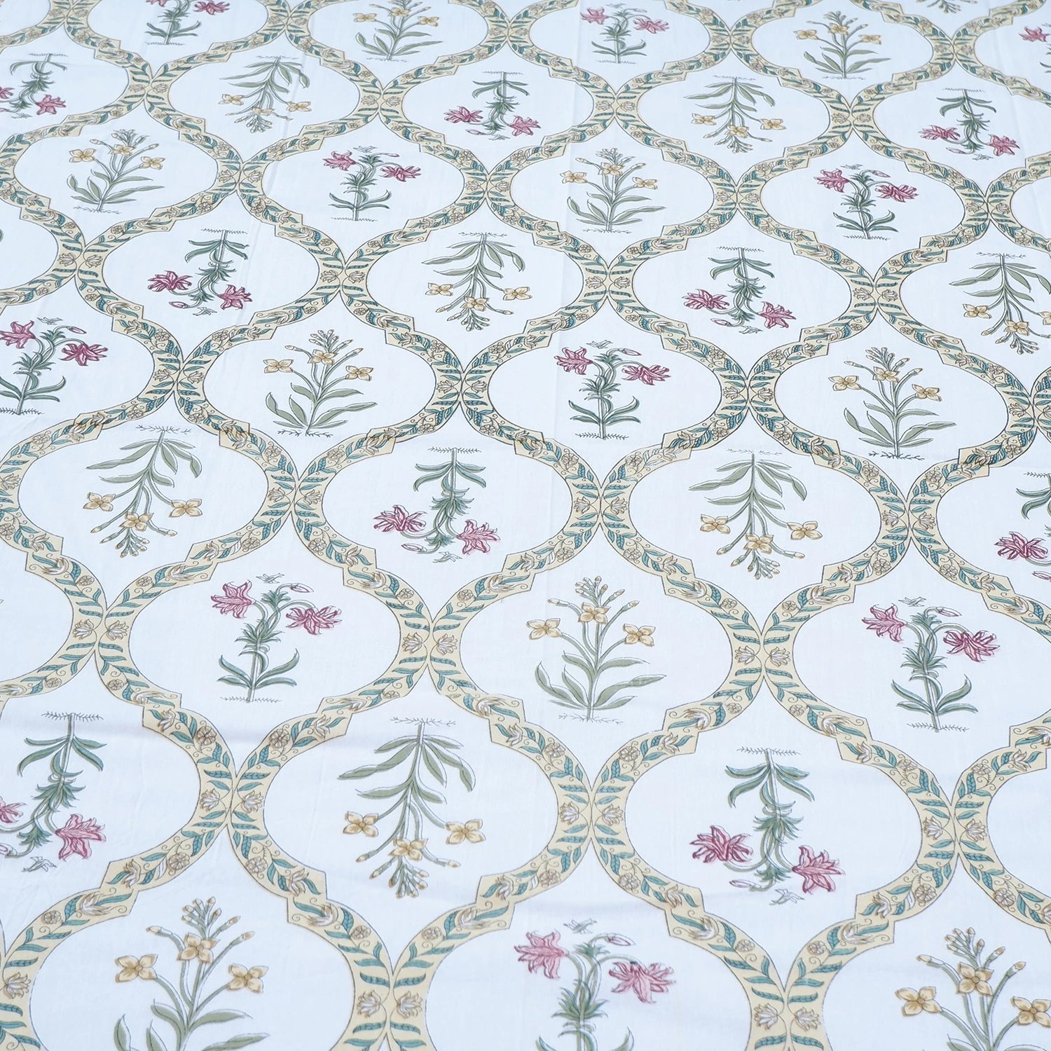 Jaipuri cotton bed sheet featuring intricate floral patterns in soft colors for elegant bedroom decor