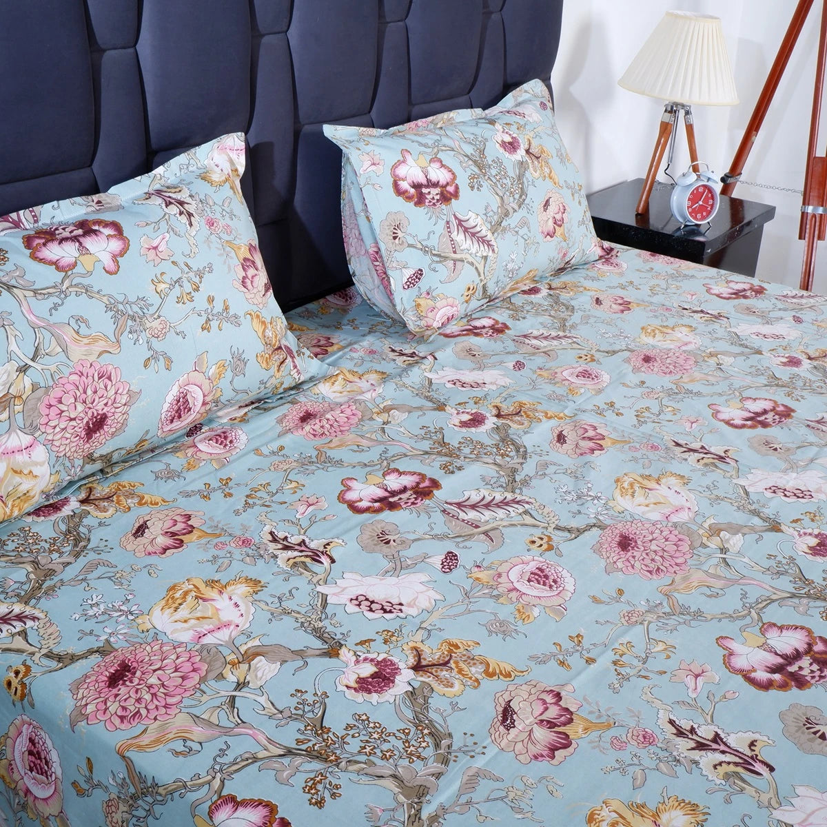 Jaipuri cotton bedsheet online in blue with floral patterns and matching pillow covers for a stylish bedroom
