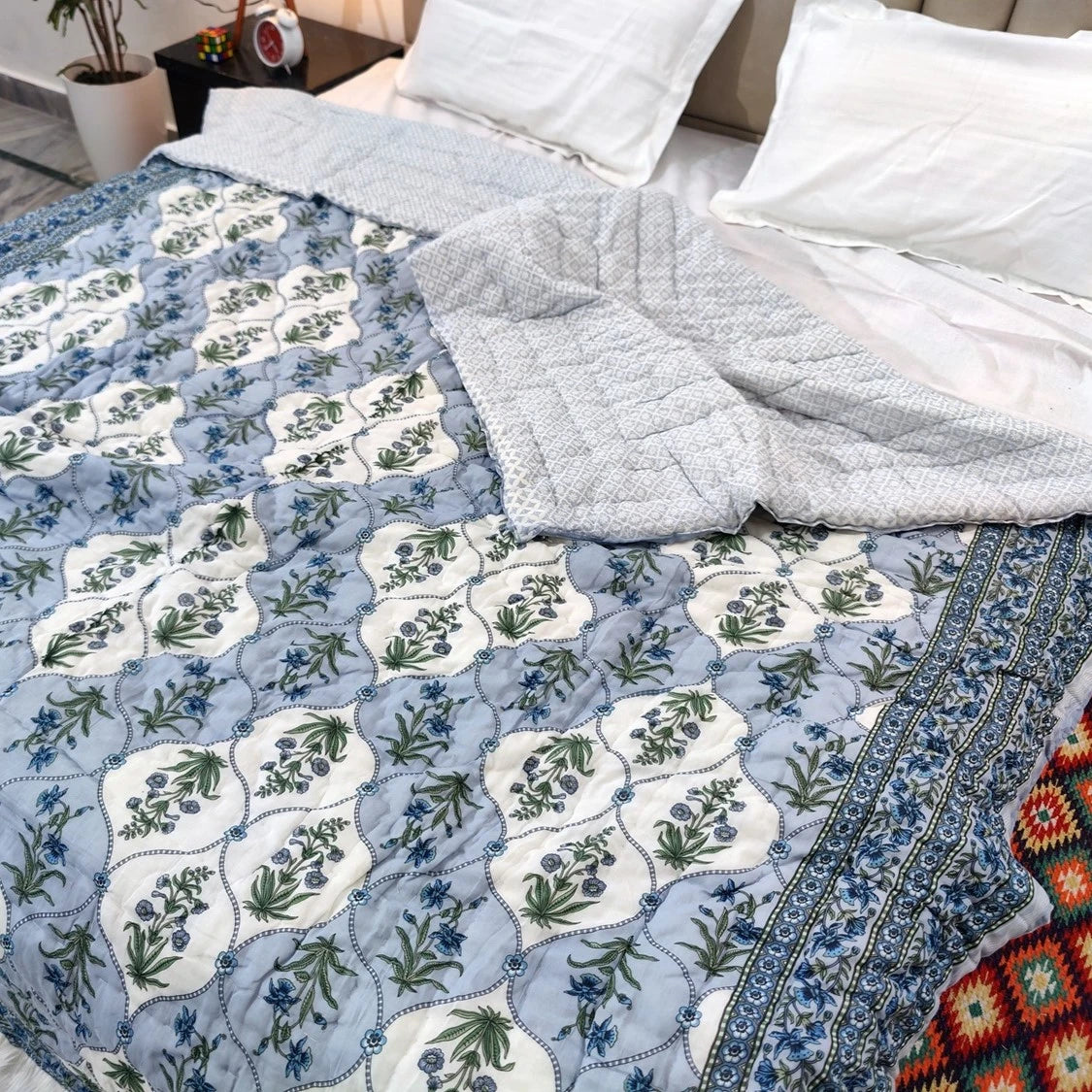 Jaipuri cotton quilt double bed featuring a floral design with soft gray backing for added comfort