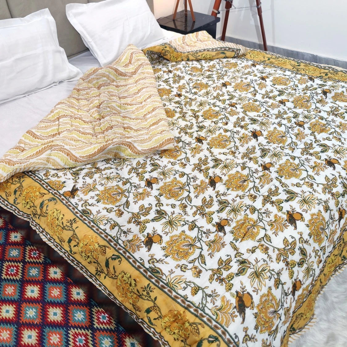 Jaipuri cotton quilt double bed featuring intricate floral patterns in yellow and white