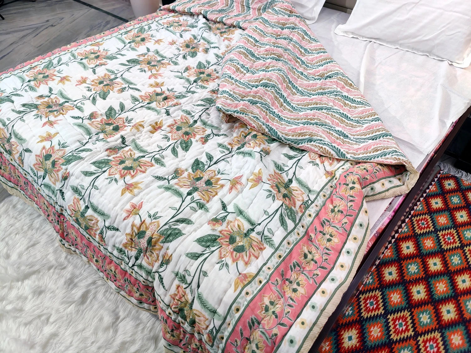 Jaipuri cotton quilt double bed featuring floral patterns and vibrant colors for cozy bedding
