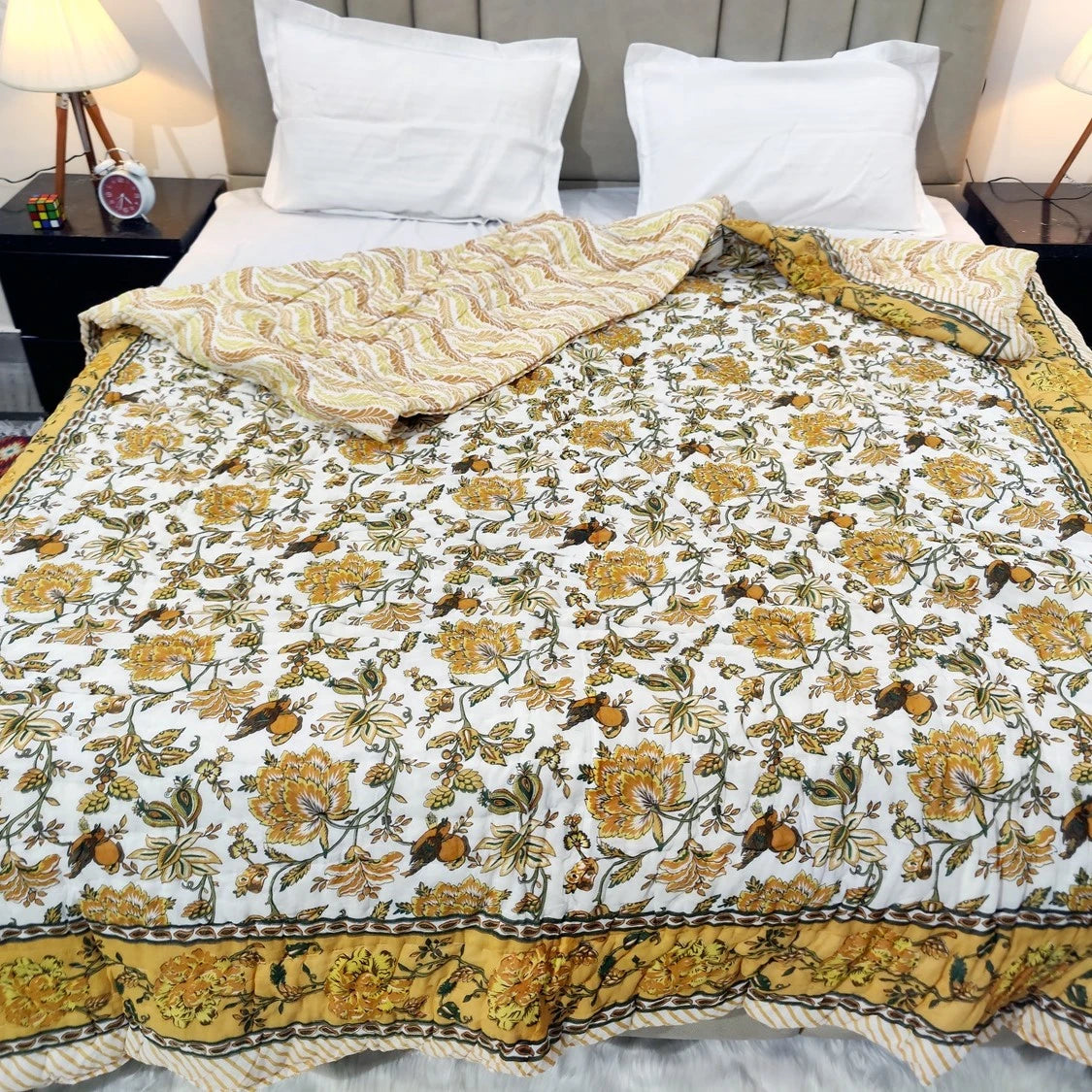 Jaipuri cotton quilt double bed featuring vibrant floral patterns and intricately designed borders
