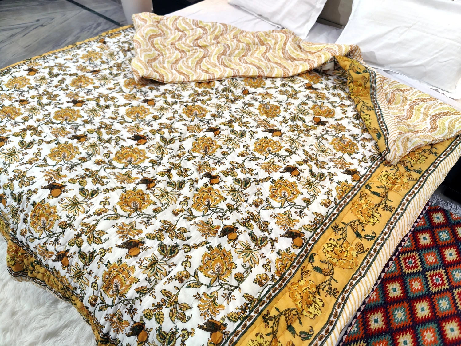 Jaipuri cotton quilt double bed featuring floral patterns in vibrant colors for cozy bedding