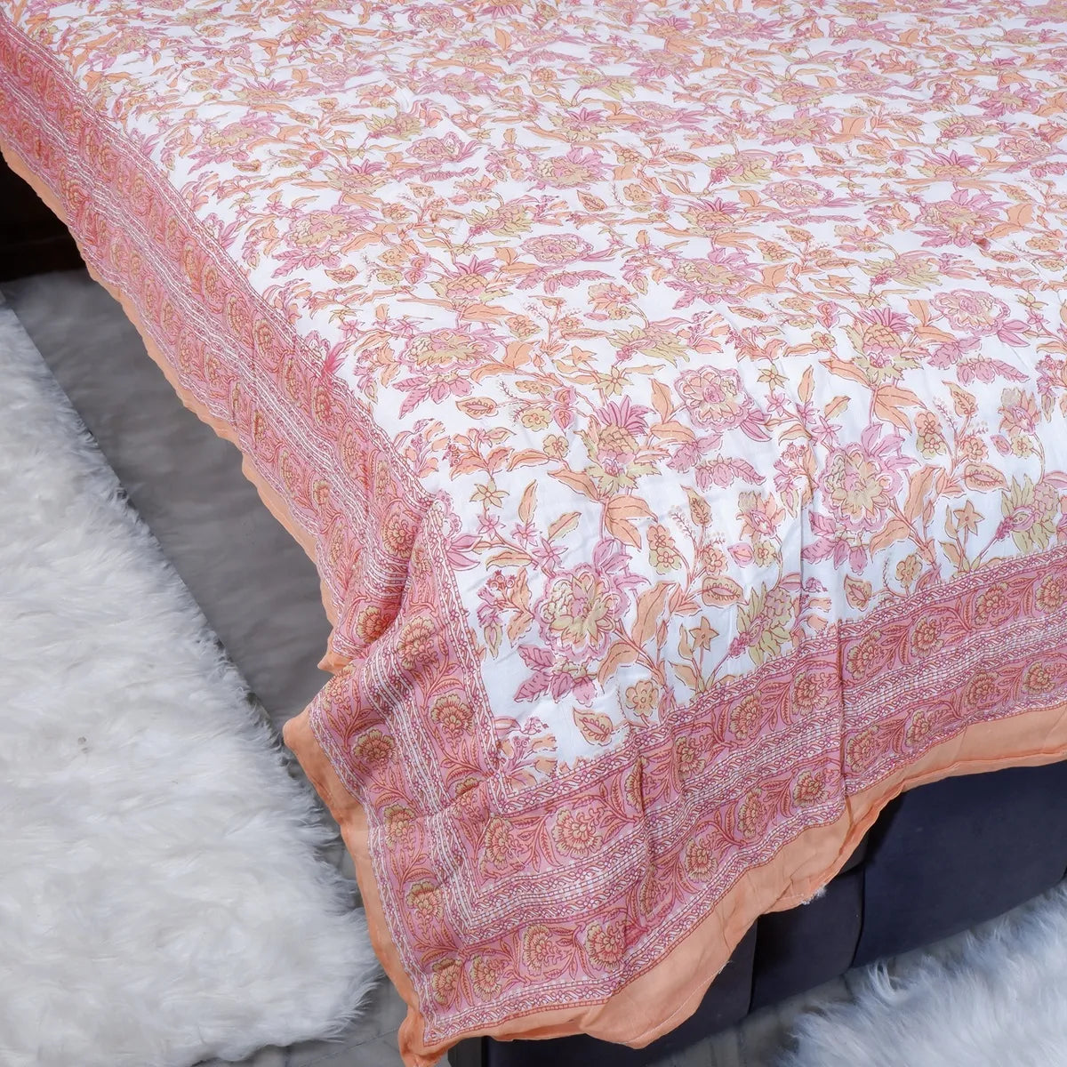 Jaipuri cotton quilt single bed with floral pattern and soft edges, perfect for cozying up at home