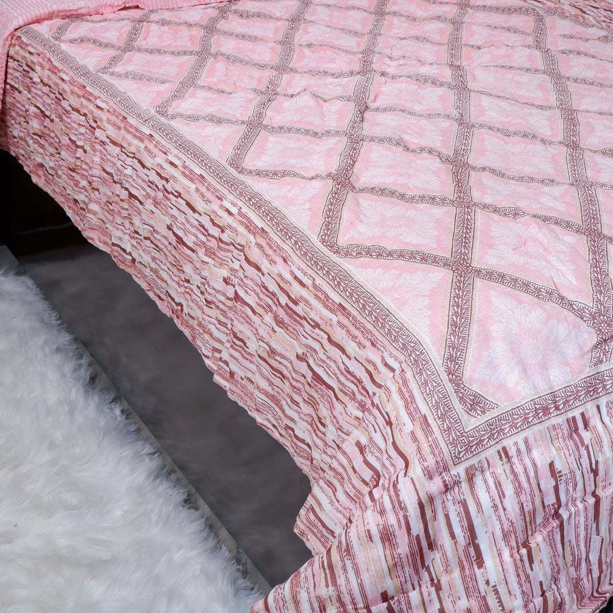 Jaipuri cotton quilt single bed in pink with intricate quilted design and textured borders