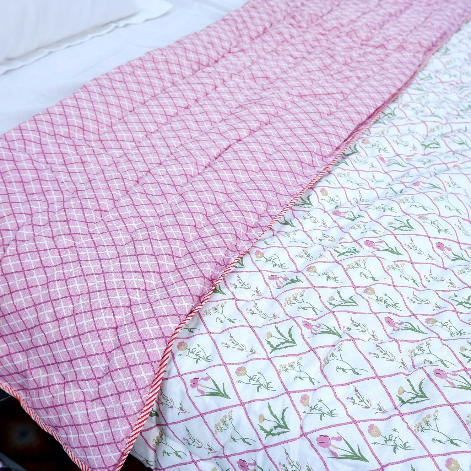 Jaipuri cotton quilts double bed featuring pink checkered and floral patterns for a cozy bedding option