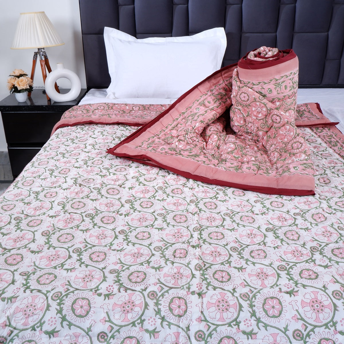 Jaipuri pure cotton quilt single bed in floral design with matching pillow cover on a neatly made bed