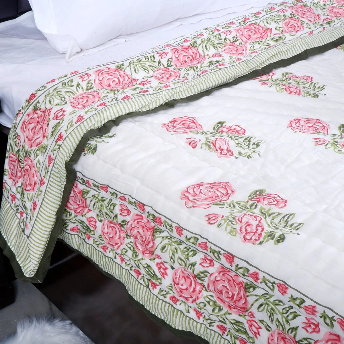 Jaipuri quilt single bed with floral patterns and green striped edges, perfect for bedroom decor