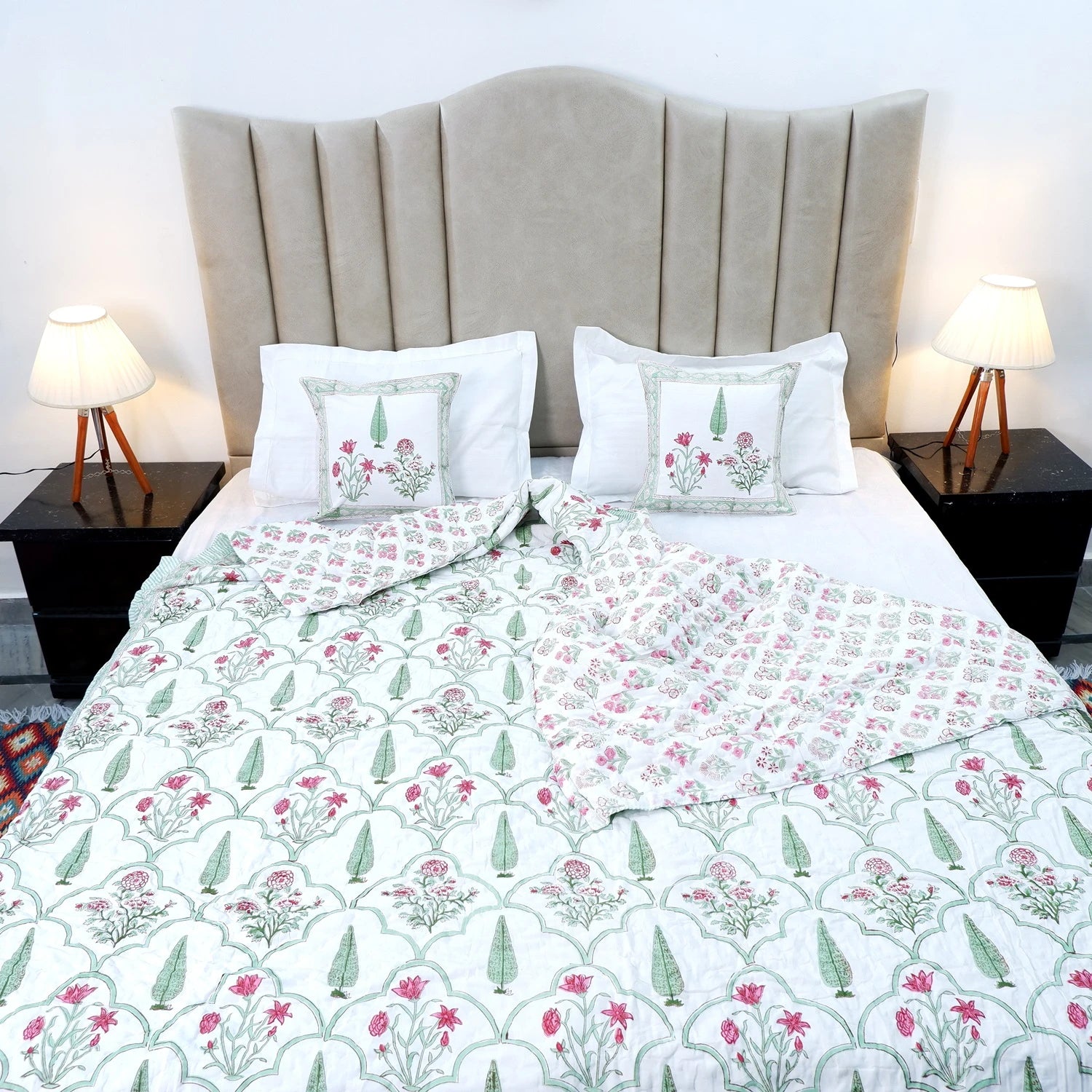 Jaipuri quilts double bed with floral pattern and paired with matching pillows on a stylish bed frame