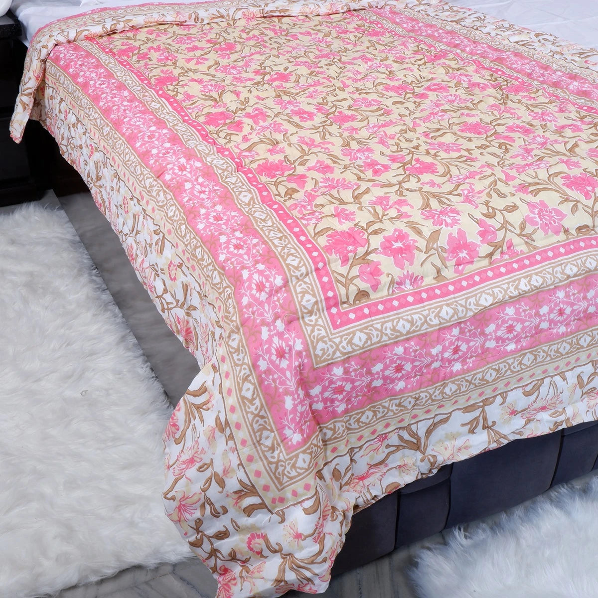 Jaipuri quilts for single bed featuring floral patterns in pink and cream colors