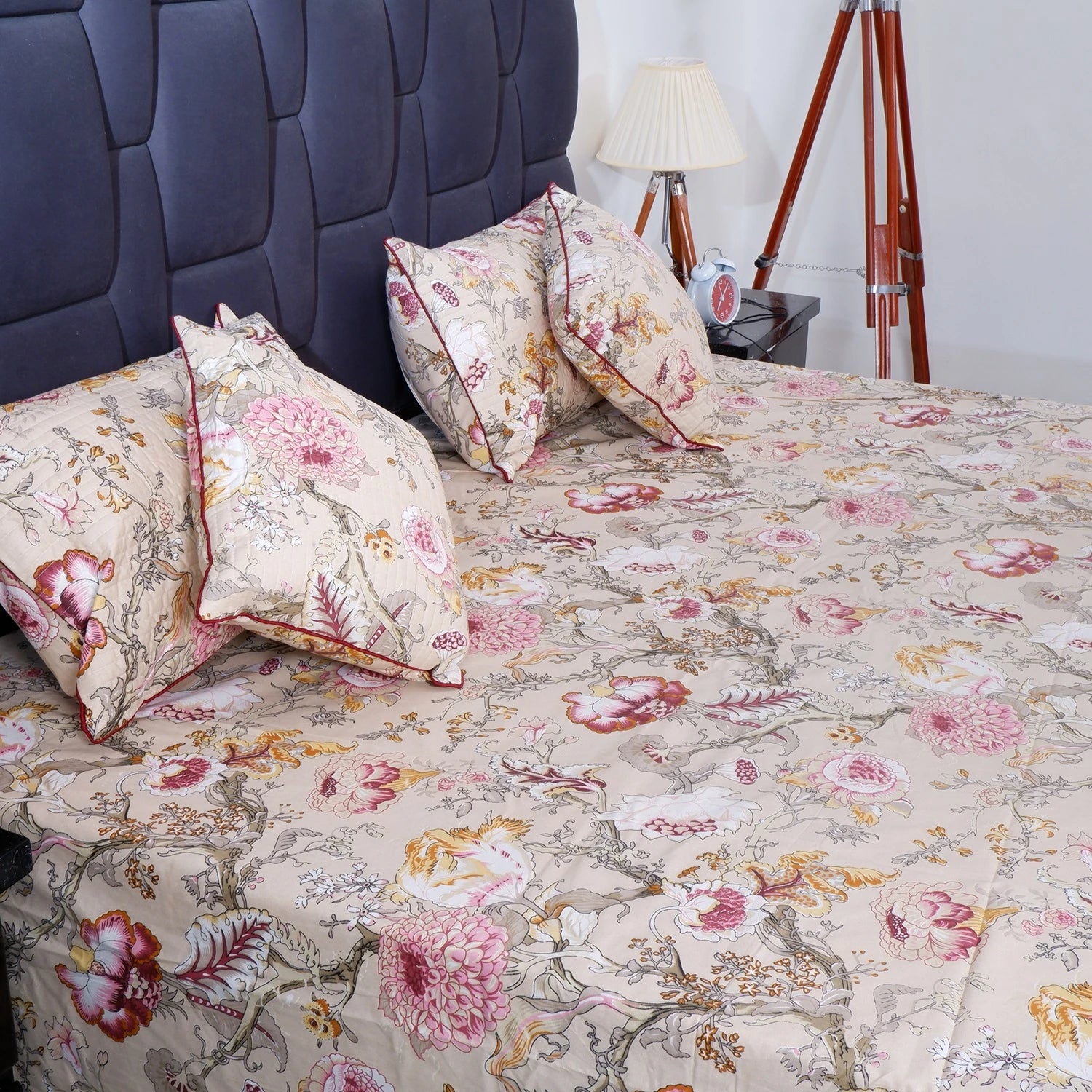 The Jaipuri pure cotton bed sheet with floral design and matching embroidered pillows for a cozy bedroom