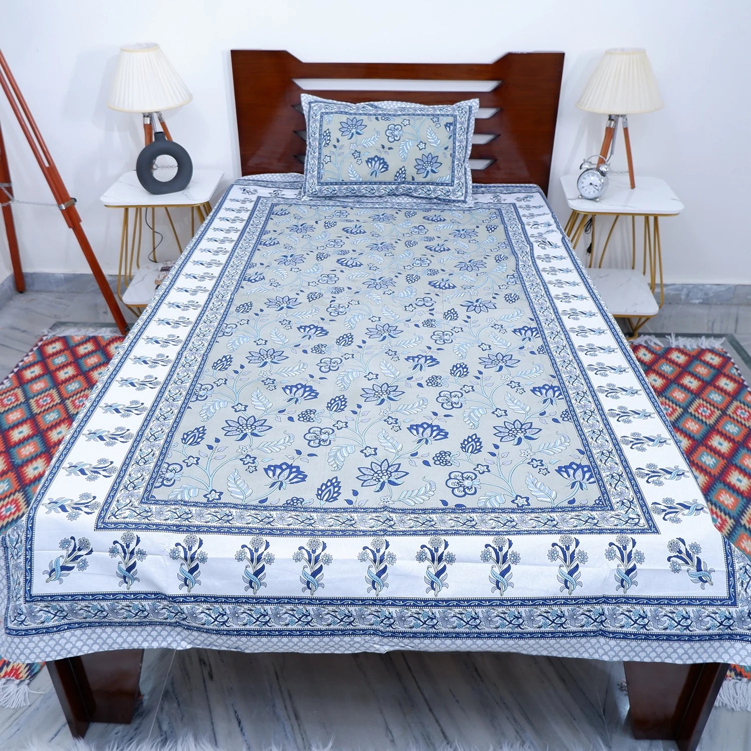 The Jaipuri pure cotton bed sheet with floral patterns in blue and white design for a stylish bedroom