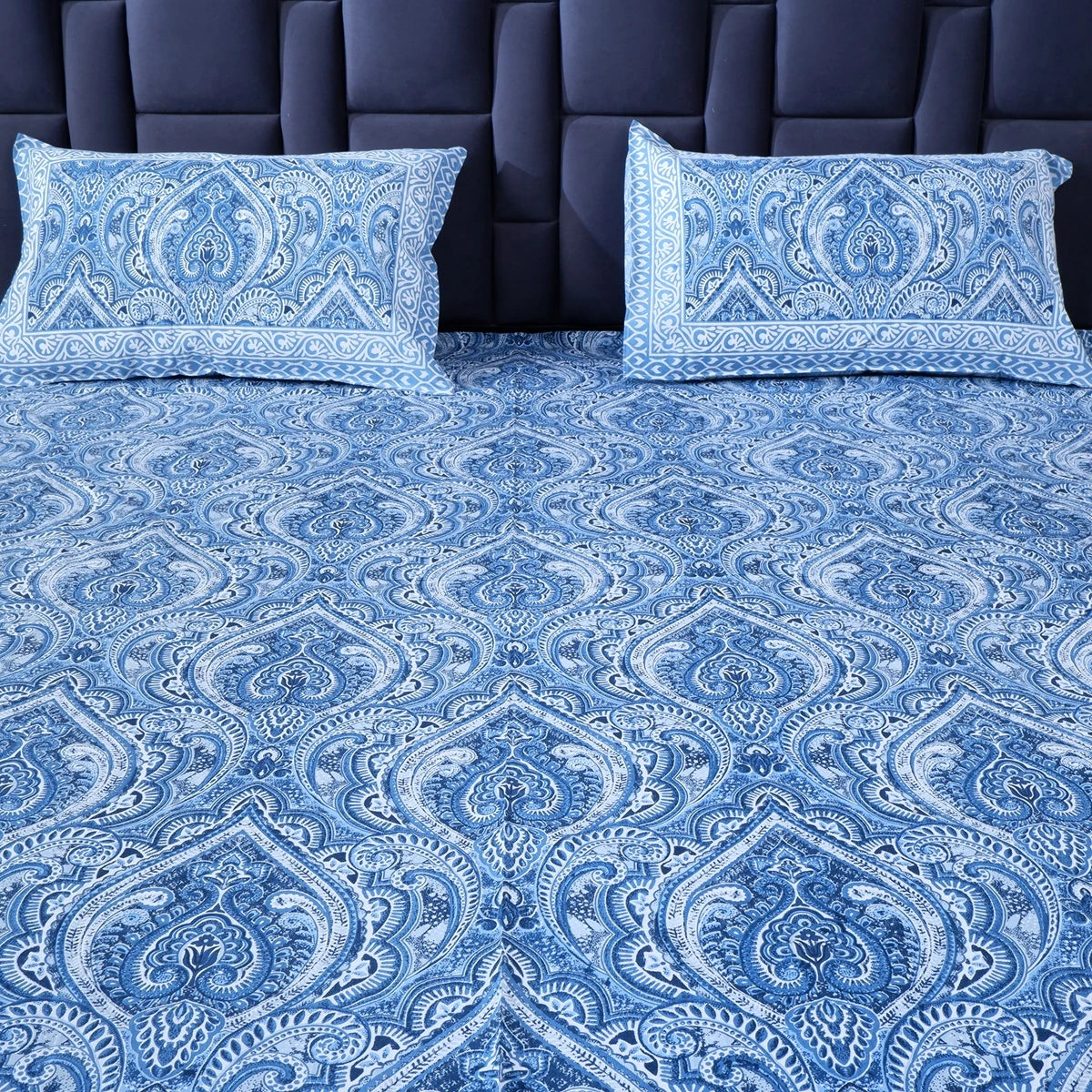 The Jaipuri pure cotton bed sheet in blue with intricate paisley design, complemented by matching pillow covers