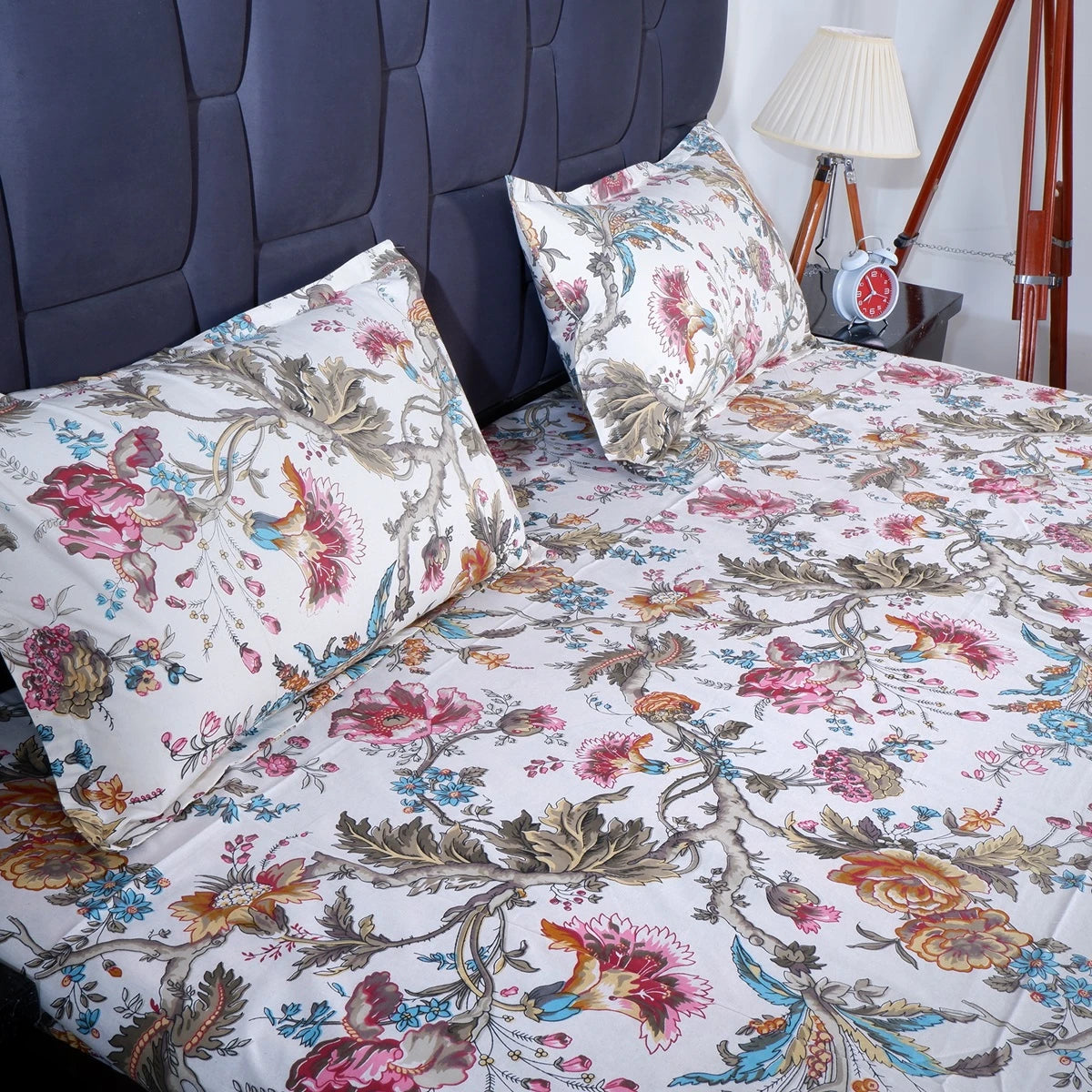 The Jaipuri pure cotton bed sheet featuring vibrant floral patterns and matching pillow covers