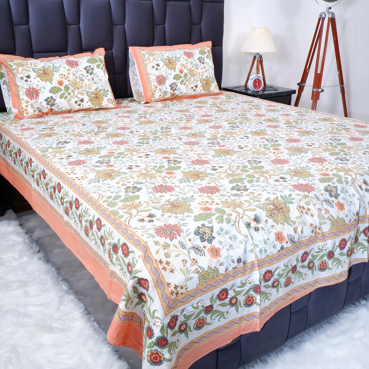 The Jaipuri pure cotton bed sheet with floral design and matching pillowcases for a vibrant bedroom decor