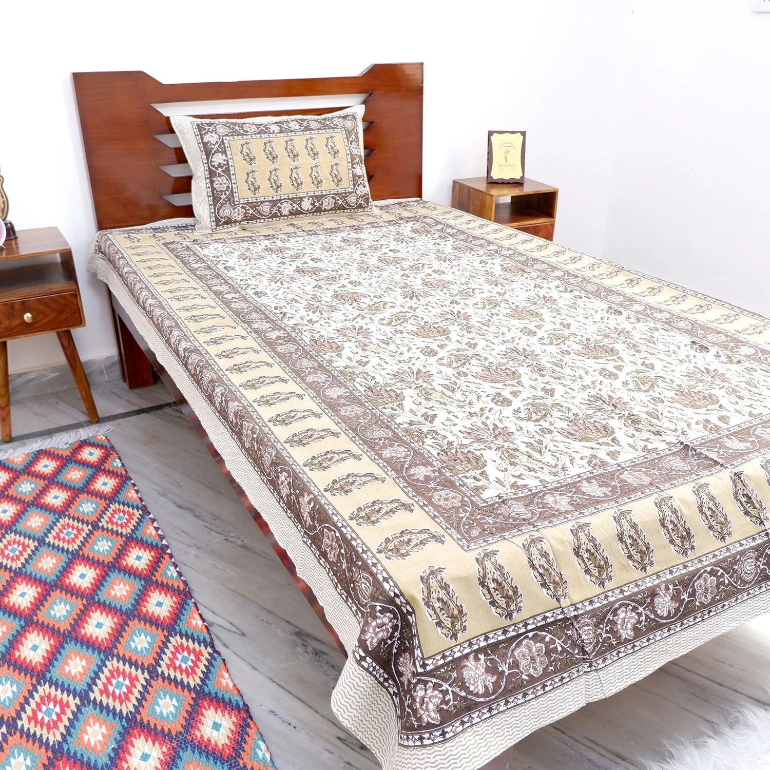 The Jaipuri pure cotton bed sheet online featuring intricate floral designs in earthy tones