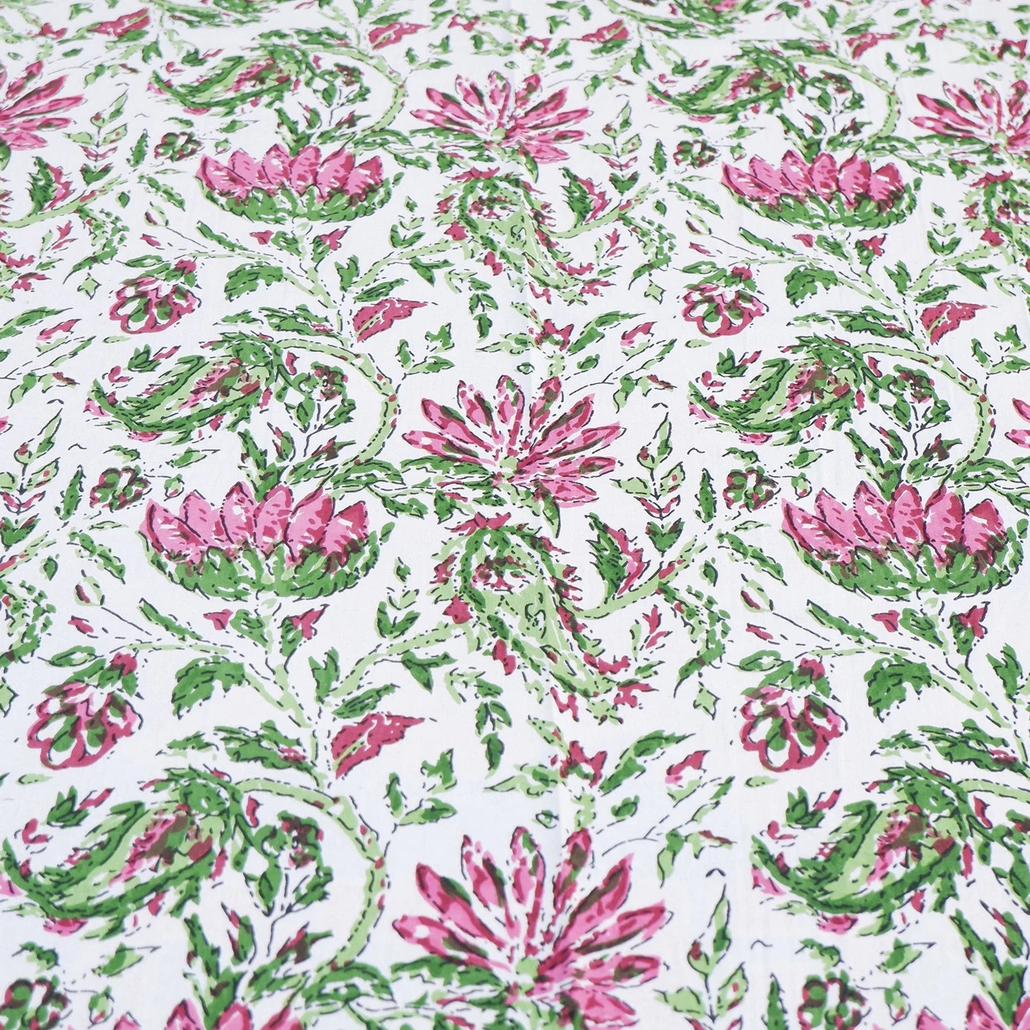 The Jaipuri pure cotton bed sheet online with vibrant floral print in pink and green hues