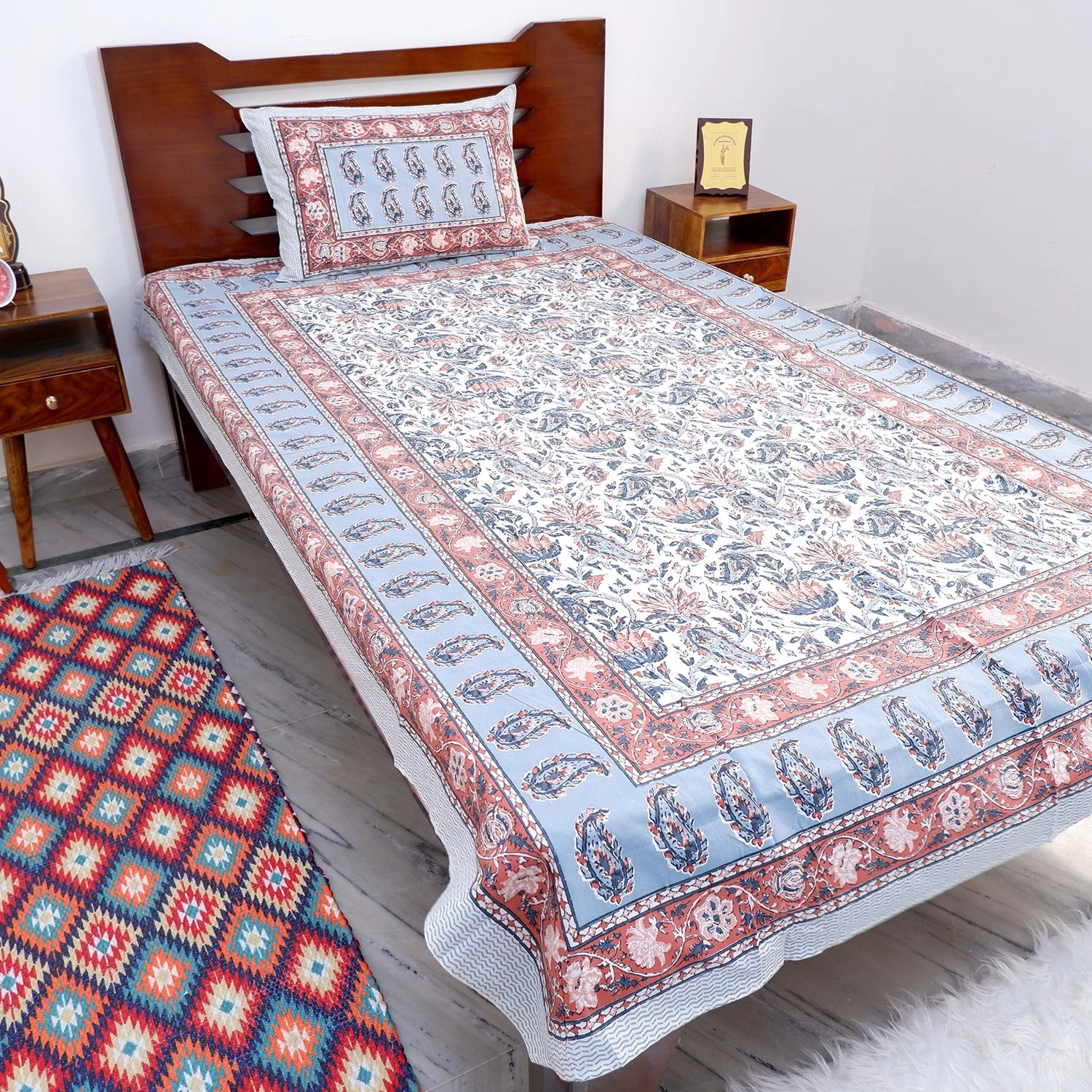 The Jaipuri pure cotton bed sheet online with intricate floral patterns and matching pillow cover